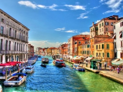 A scene of Venice city with boats floating on water